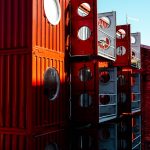 a row of red and white shipping containers
